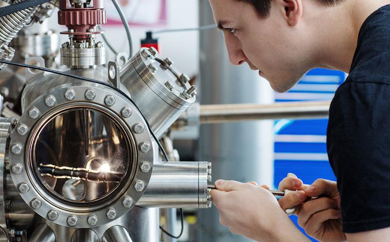 Researcher in the physics lab. Photo